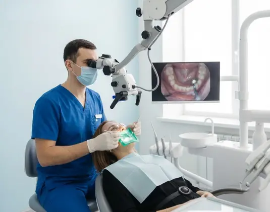 Dental treatment under a microscope photo