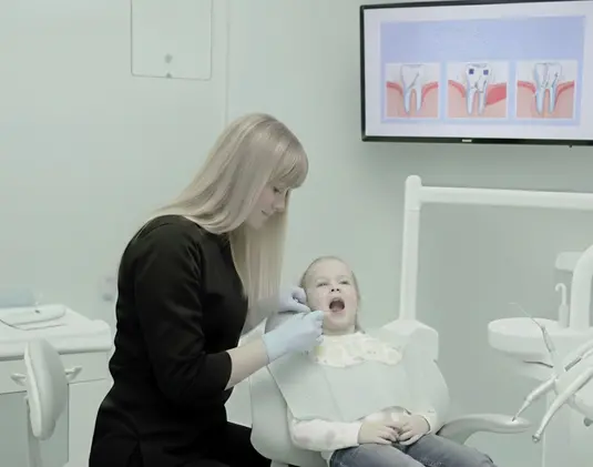 Removal of baby teeth in children photo